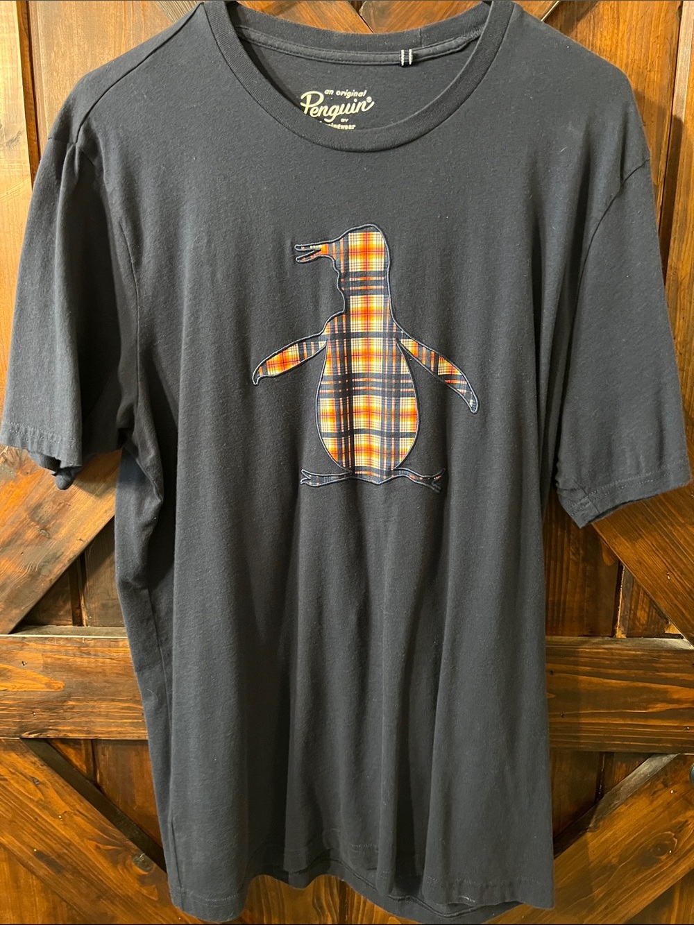 Original Penguin Black Tee with Orange-Yellow Plaid Penguin